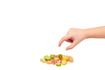 Kids hand with colored round candy, sugar lollipop