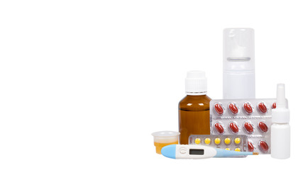 Bottle with medicine, nasal spray. Antipyretic syrup and pills. Medication for cold treatment