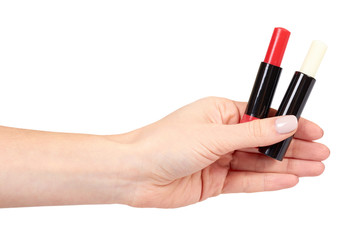Hand with red and white balm lipstick, lips care and beauty