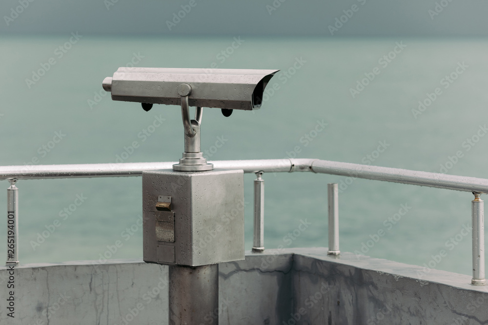 Wall mural coin operated binoculars with sea view, close up