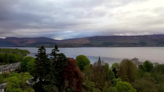 Aerial depiction of the beautiful village of Luss and majestic Ben Lomond,  situated on the banks of Loch Lomond, Scotland.
