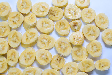 Close up slice yellow banana isolated on white background