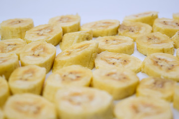 Close up slice yellow banana isolated on white background