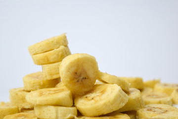 Close up slice yellow banana isolated on white background