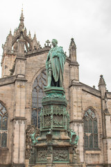 Fototapeta na wymiar Walter Francis Montagu Douglas Scott Statue on Parliament Square next to St Giles' Cathedral Edinburgh Scotland