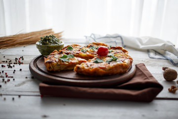 homemade egg and vegetable pie with sauce pesto