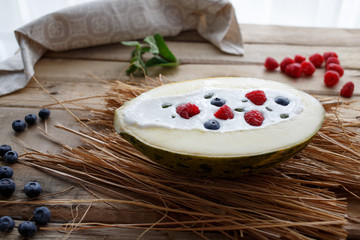 Melon with yoghurt and berries with mint at home