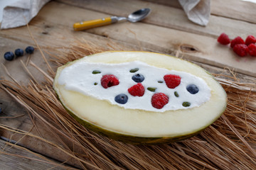 Melon, yoghurt, raspberry, blueberry. Homemade.