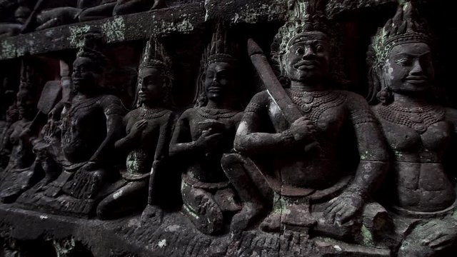 Close view of greatly detailed stone carvings on the wall of the Terrrace of the Leper King. It is located in the northwest corner of the Royal Square of Angkor Thom, Cambodia.