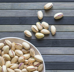 Healthy food  for background image close up pistachios nuts. Texture on top view Nuts pistachio on the cup plate