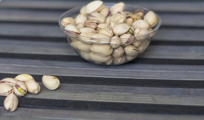 Healthy food  for background image close up pistachios nuts. Texture on top view Nuts pistachio on the cup plate