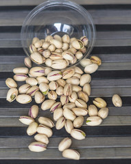 Healthy food  for background image close up pistachios nuts. Texture on top view Nuts pistachio on the cup plate