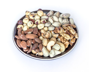 Healthy food. Nuts mix assortment on white grey table top view. Collection of different legumes for background image close up nuts, pistachios, almond, cashew nuts, peanut, walnut. image