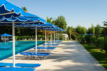 Blue swimming pool at luxury hotel, Greece