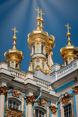 Fototapeta na wymiar Golden onion cupolas of the chapel of the Catherine's Palace in Pushkin, Russia