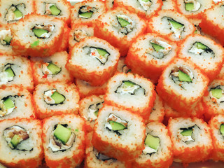 Sushi roll with red caviar, traditional Japanese food.