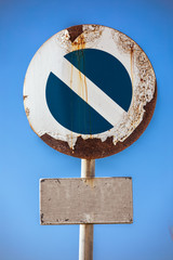 Road sign prohibiting access, at the bottom a sign with empty space to customize. In the background...