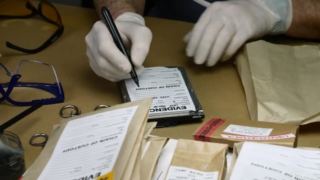 Police expert examines hard drive in search of evidence