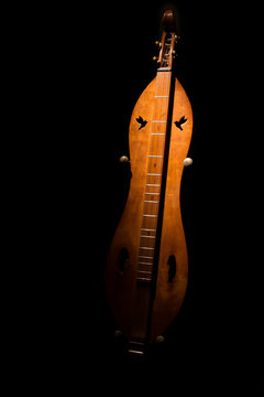 Mountain Dulcimer On Black Background