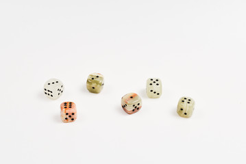Dices made of natural stone on a white background. Copy space. Gaming.