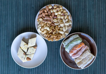 Traditional Turkish Delight. Oriental dessert halva on a  plate. Eastern delicacy sweets. Healthy...