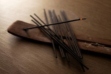 incense sticks on wooden background