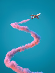 airplane with spiral pink trail - obrazy, fototapety, plakaty