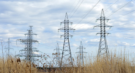 The posts of the power station against the sky. Transmission of electricity.
