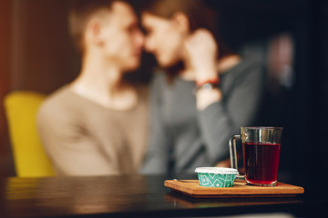 Young and loving couple sitting in a cafe