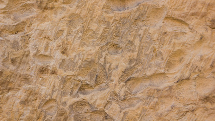 Background of the old wall. Texture of stone surface. Abstract background in retro style. Brown surface of solid material