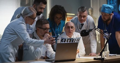 Doctors analyzing MRI scan results