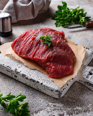 Raw meat on cutting board