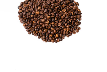 heap of coffee beans on white background