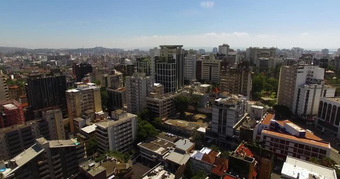 Porto Alegre, Brazil: Aerial landscape of modern urban city in South America. Dolly to the left in aerial video.