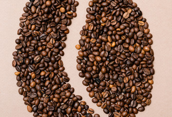coffee beans laid out in the form of coffee beans on a paper background
