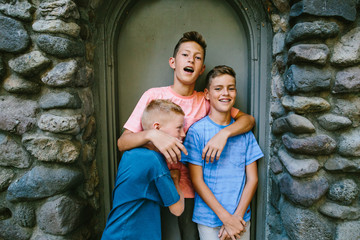 Youngest brother playfully punches older brother in stomach