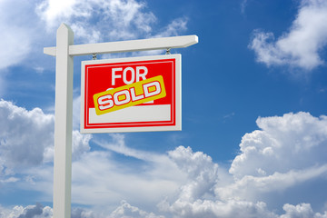 Sold For Sale Real Estate Sign over Clouds and Blue Sky. 3d Illustration