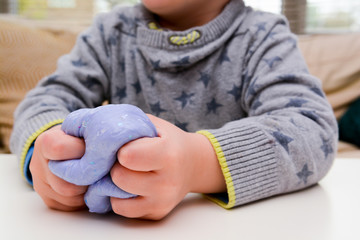 Playing with home made slime. Child plays with slime made from recipe