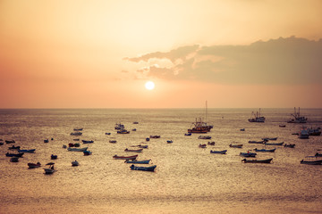 sunshine sea view with boats, red light