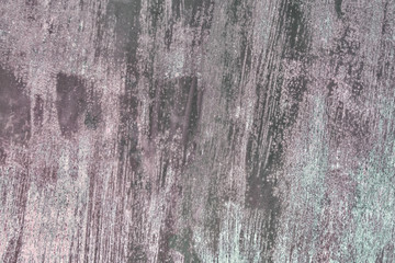 Abstract background with stains of old paint. Metal sheet unevenly painted with gray paint. Blank background for layouts.
