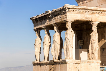 Obraz premium Athens, Greece. The Porch of the Caryatids at the Erechtheion, an ancient Greek temple on north side of the Acropolis dedicated to Athena and Poseidon