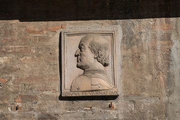 The effigy of Federico da Montefeltro, military leader and lord of Urbino during the Italian Renaissance. The Latin inscription means: "The divine Federico, lord of Urbino"