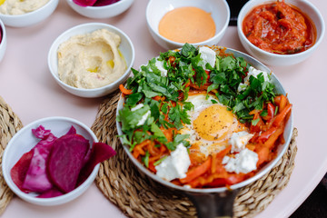 Shakshuka, Fried Eggs in Tomato Sauce on the Table