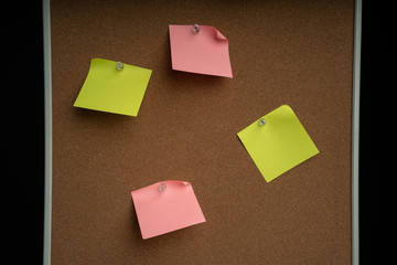 notebook blank paper sheet on corkboard in the office white wall