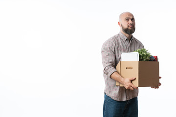 Fired businessman holding box with personal belongings.