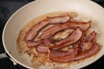 Bacon Strips Fried on Skillet