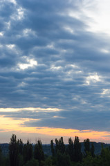 Fototapeta premium Landscape with dramatic light - beautiful golden sunset with saturated sky and clouds.