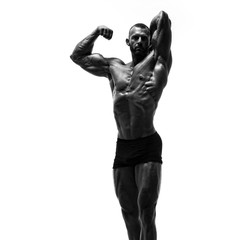 Fototapeta na wymiar Black and White Image of Strong Muscular Men Flexing Muscles