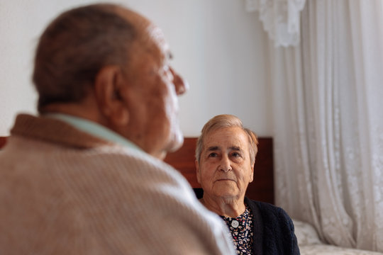 Portrait of an elderly couple in their home interior