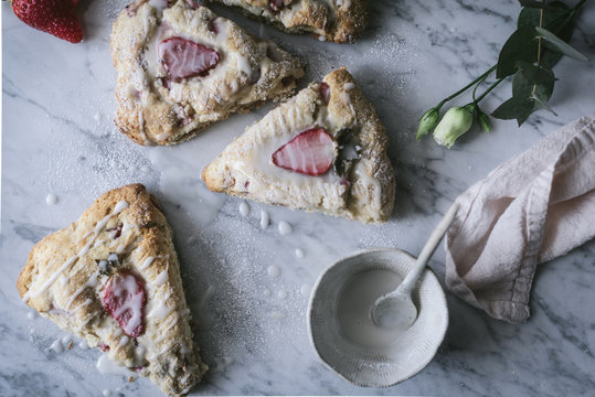 Strawberry scones on marble table